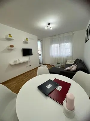 a white table and chairs in a living room at Natalija Stan na dan in Banja Luka