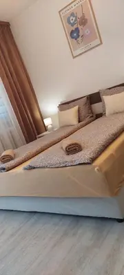 two beds sitting next to each other in a bedroom at VIEW APARTMENT in Visoko
