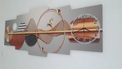 a group of clocks hanging on a wall at VIEW APARTMENT in Visoko