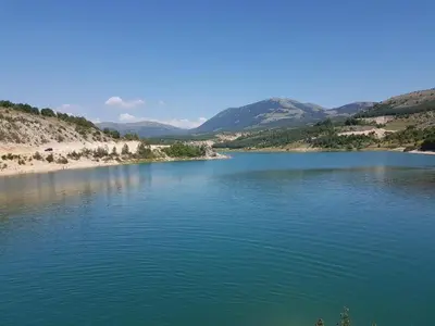 a large body of water with mountains in the background at Apartman Potok in Livno