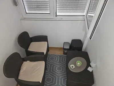 a small room with a chair and a table at Bilino polje in Zenica
