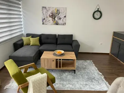 a living room with a couch and a coffee table at Damade apartments in Jajce