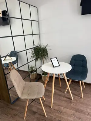 two chairs and a table and a table and chairs at Damade apartments in Jajce