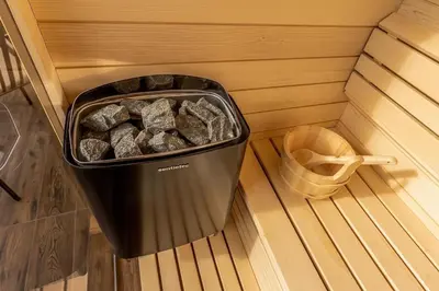 a trash can in a sauna with a toilet at Platinum_Luxury_Apartment in Teslić