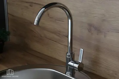 a kitchen sink with a chrome kitchen faucet at Apartment Deluxe in Jajce