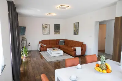 a living room with a couch and a table at Holiday Home Libera in Bihać