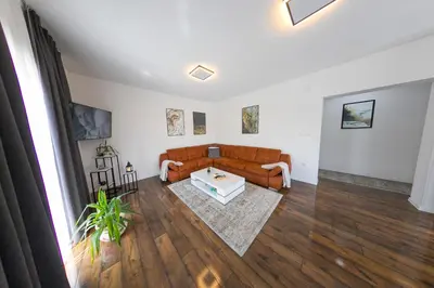 a living room with a couch and a table at Holiday Home Libera in Bihać