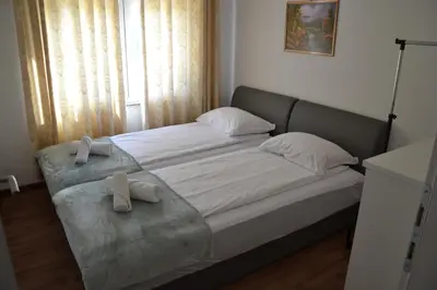 a bedroom with a bed with two towels on it at Villa River and Sky in Bihać