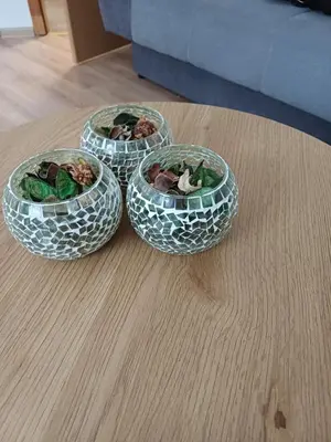 three glass bowls sitting on a wooden table at Rose Apartment in Jajce