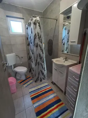 a small bathroom with a sink and a toilet at Kuca za odmor Una-Mia in Kulen Vakuf