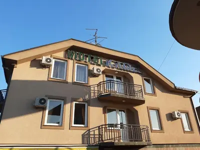 a building with balconies on the side of it at Hotel Kamel in Banja Luka