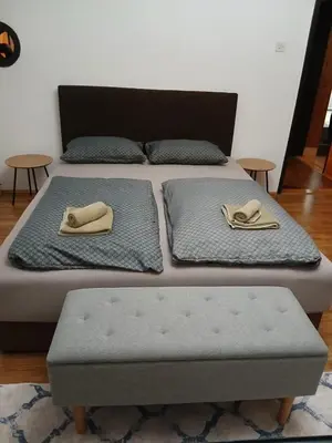 a bed with two pillows on top of it at Apartment View in Jajce