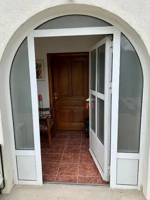 an arched doorway to a room with a door at Sokograd Attic in Šipovo