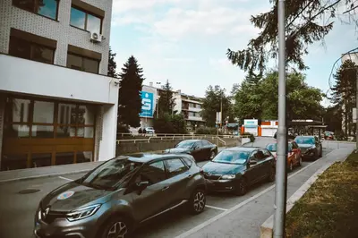 a group of cars parked in a parking lot at Studio apartman NEI in Tuzla