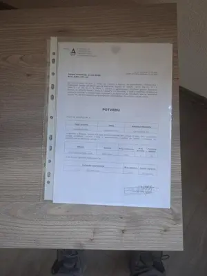 a piece of paper sitting on top of a table at Apartman Knežević in Donja Varoš