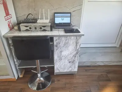 a desk with a laptop computer on top of it at Vikendica Avram-Plane in Plane