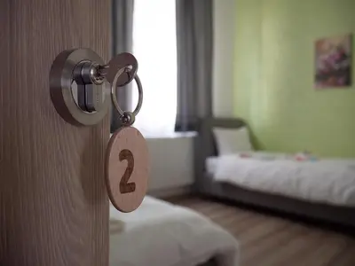 a door with a number two on it in a bedroom at Motel Rezime in Zenica