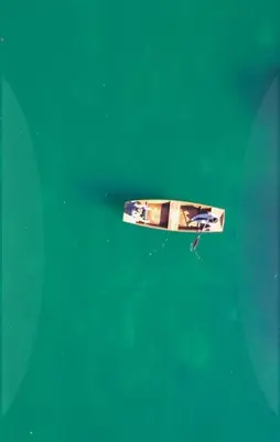a boat floating in the water in the ocean at Bosanska kuća Emina in Bihać