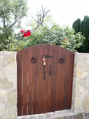a large wooden gate with a lock on it at Bosanska kuća Emina in Bihać
