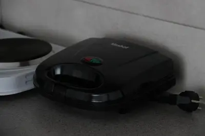 a black toaster sitting next to a toilet at Apartman Eva in Jajce