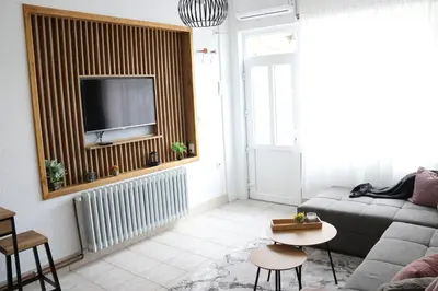 a living room with a couch and a tv at Apartman Eva in Jajce