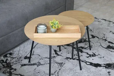 a wooden table with flowers on top of a table at Apartman Eva in Jajce