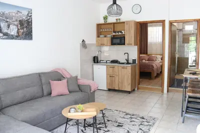 a living room with a couch and a table at Apartman Eva in Jajce