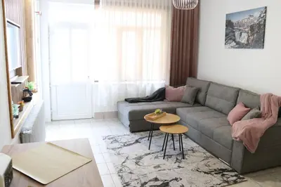 a living room with a couch and a table at Apartman Eva in Jajce