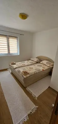 a bedroom with two beds in a room at Apartman Naza in Kulen Vakuf