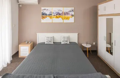 a bedroom with a bed with two pillows on it at Apartment Titanic 3 in Tuzla