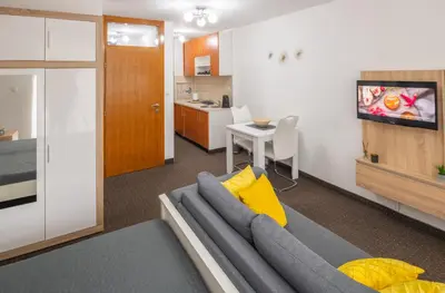 a living room with a couch and a table at Apartment Titanic 3 in Tuzla
