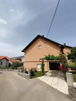 a house with a garage in front of it at Barišić in Livno
