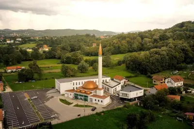 an aerial view of a church with a steeple at CIOM Apartment in Matuzići
