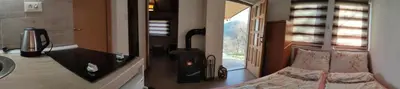 a bathroom with a bed and a sink and a mirror at Positive vibes in Visoko