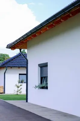 a white house with a window and a roof at Vikendica Krcmarice- Banja Luka in Banja Luka