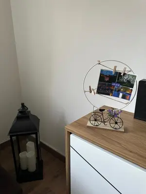 a table with a mirror on top of a dresser at Sara in Jajce