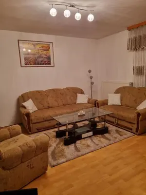 a living room with two couches and a coffee table at Ferienwohnung Sabina in Bosanska Krupa