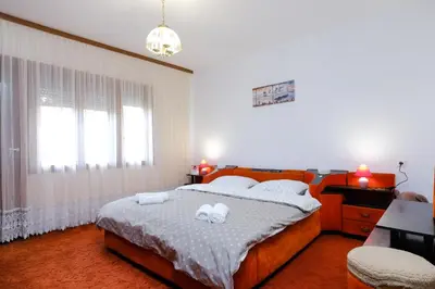 a bedroom with a bed with two towels on it at The Cosmic Gate 3 in Biskupići