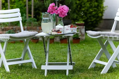 a table with a tray of food and flowers on it at The Cosmic Gate 3 in Biskupići