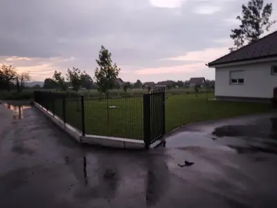 a fence in the middle of a parking lot at Vikendica Ninic in Laktaši