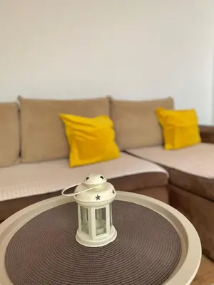 a table in a living room with a tea pot on it at Apartman AndjelA in Banja Luka