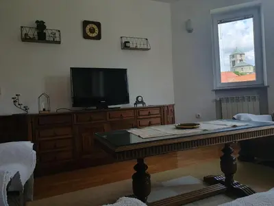 a living room with a tv and a coffee table at Mia in Tomislavgrad