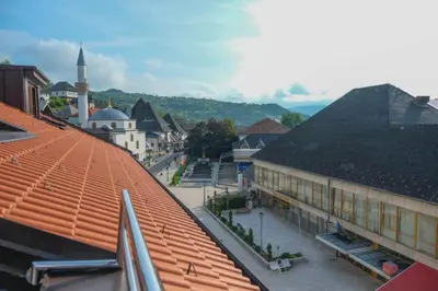 a view of a city from a roof of a building at Penthouse in Jajce