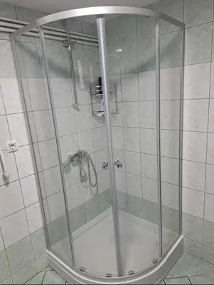 a shower with a glass door in a bathroom at Apartman Ivo in Livno
