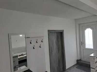 a white room with a door and a window at Apartman Ivo in Livno