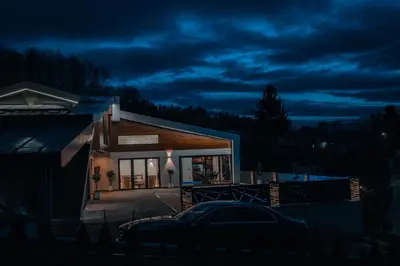 a house with a car parked in front of it at night at Villa 4A Visoko in Visoko