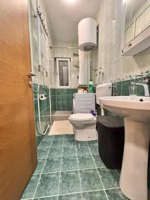 a bathroom with a toilet and a sink and a shower at Old Town Central in Banja Luka