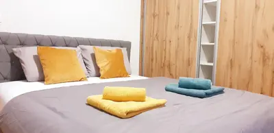 a bed with two pillows on top of it at Old Town Central in Banja Luka