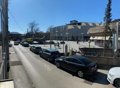 a group of cars parked in a parking lot at Old Town Central in Banja Luka