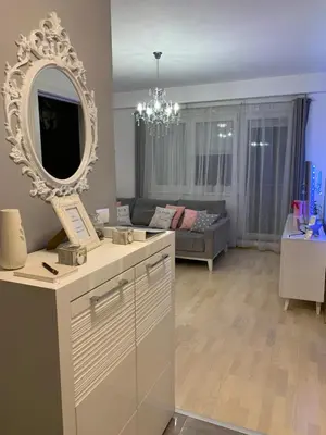 a living room with a mirror and a couch at Apartment Sweet Home Banja Luka in Banja Luka